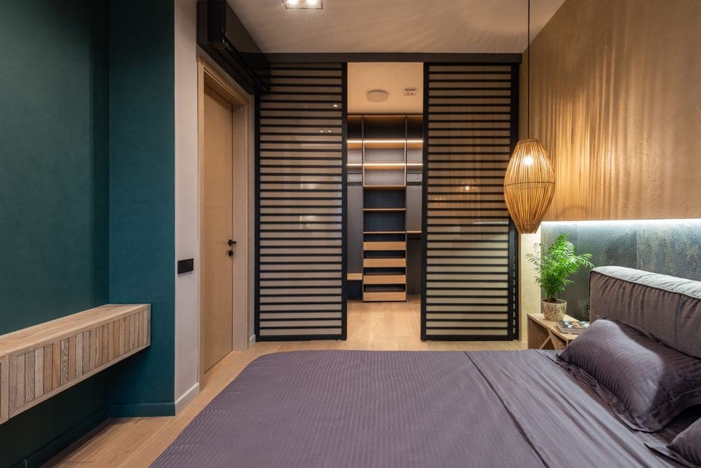 A bedroom door with hanging storage on it