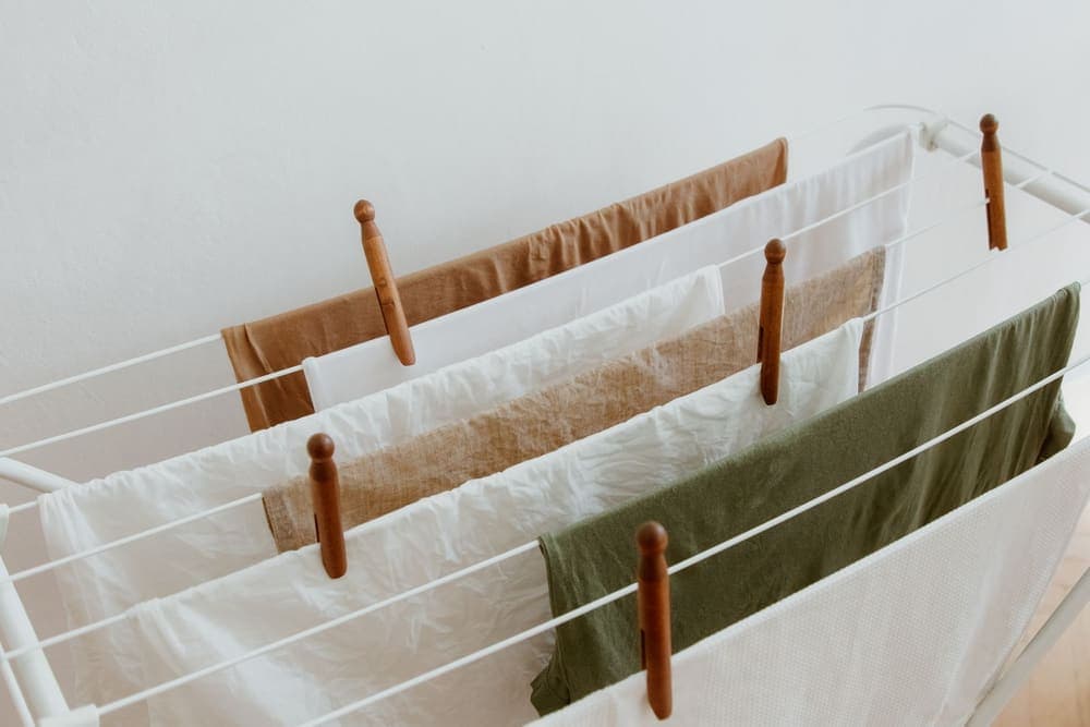 Clothes drying on a folding rack indoors