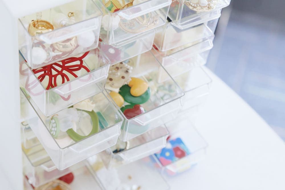 Jewelry sorted into small clear pull-out drawers