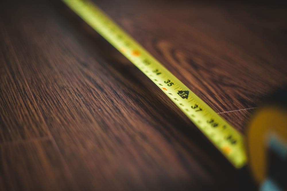 A tape measure resting on a work surface