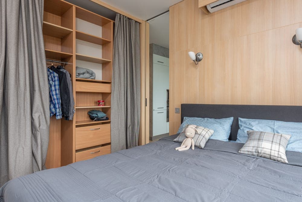 Storage and shelving in a small apartment bedroom