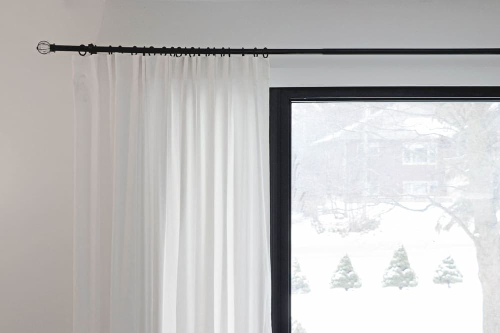 A light curtain hanging across a window opening