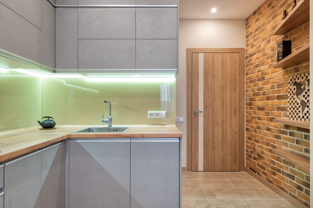 Storage inside an under-sink kitchen cabinet